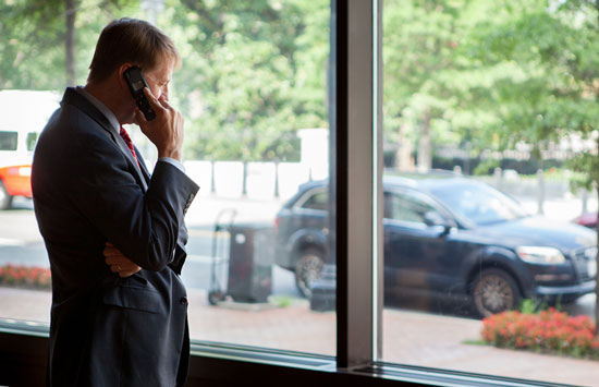 Photo of Confirmation Day: Director Cordray taking a moment to make calls and share the big news